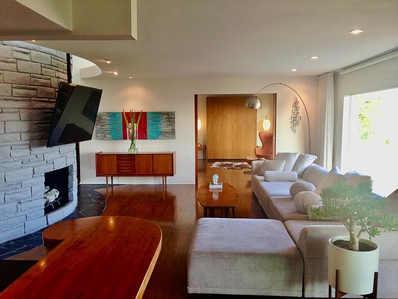 Large Living room with big beautiful windows of the view, Guest room has a built in Murphy bed and sitting area