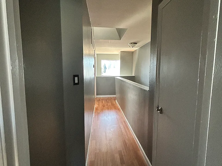 Hallway view from second bedroom - storage closet to right