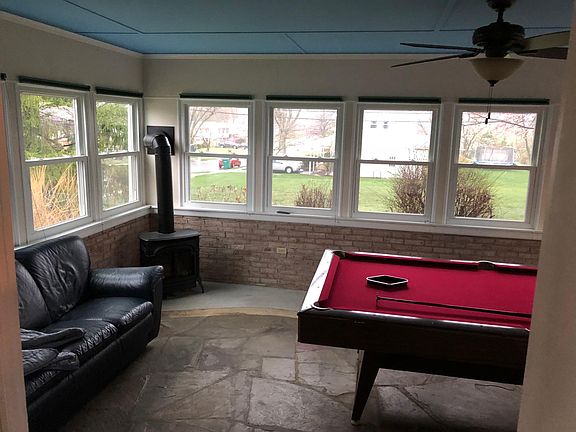 Spacious sunroom that leads to large deck & fenced yard with