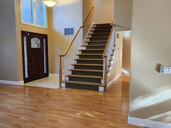 Entry and stairway, hardwood floors throughout house