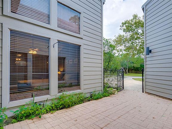 The front entry has a gated patio. There is enough room to put patio furniture to enjoy the beautiful Fall weather!