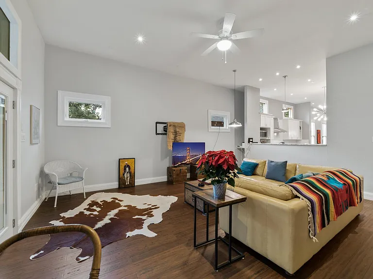 Living opens to the good-sized screened in porch.