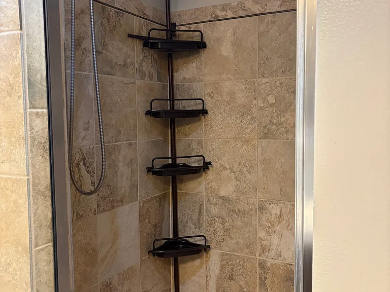 Hallway Full Bathroom view of shower