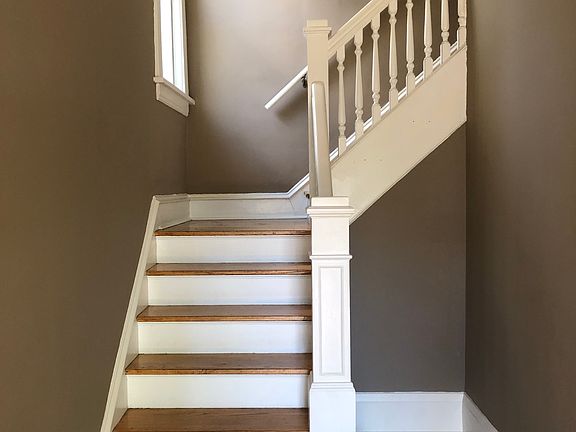 Private entry with the home's original staircase.