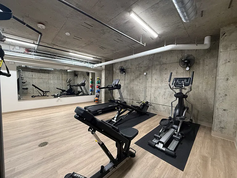 Stay active in the fitness center at Anker Ballard, equipped with treadmills, weight machines, and other exercise equipment.