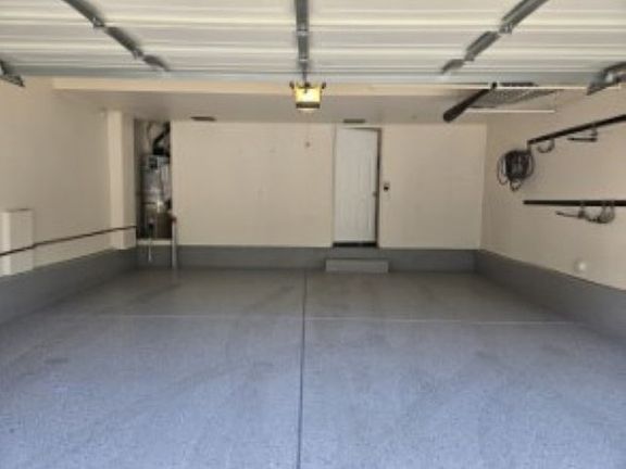 4) Attached Two Car Garage with Epoxy Floor & Storage Hooks