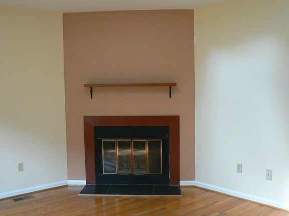 Living room with wood floors and fireplace