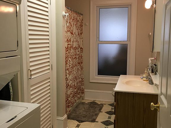 Full bathroom with washer and dryer included.
