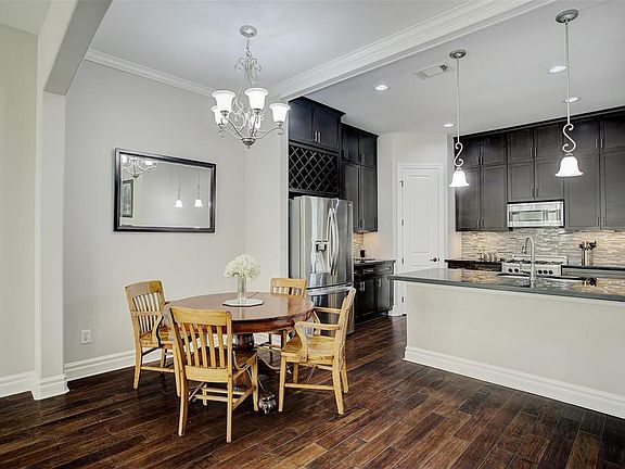 Dining area opens into the kitchen on one side and the living room on the other. Great open floorplan!