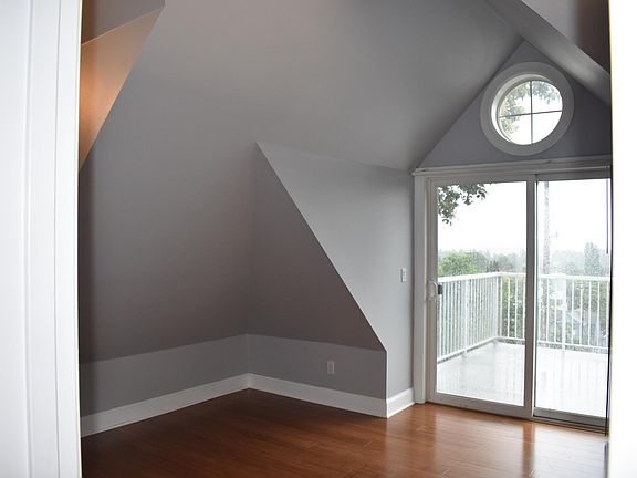Upstairs Bedroom with east facing deck. Top Floor.