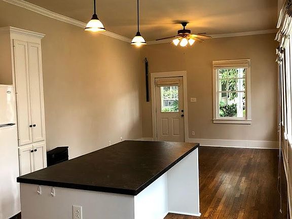 Front facing view of the kitchen and living room.