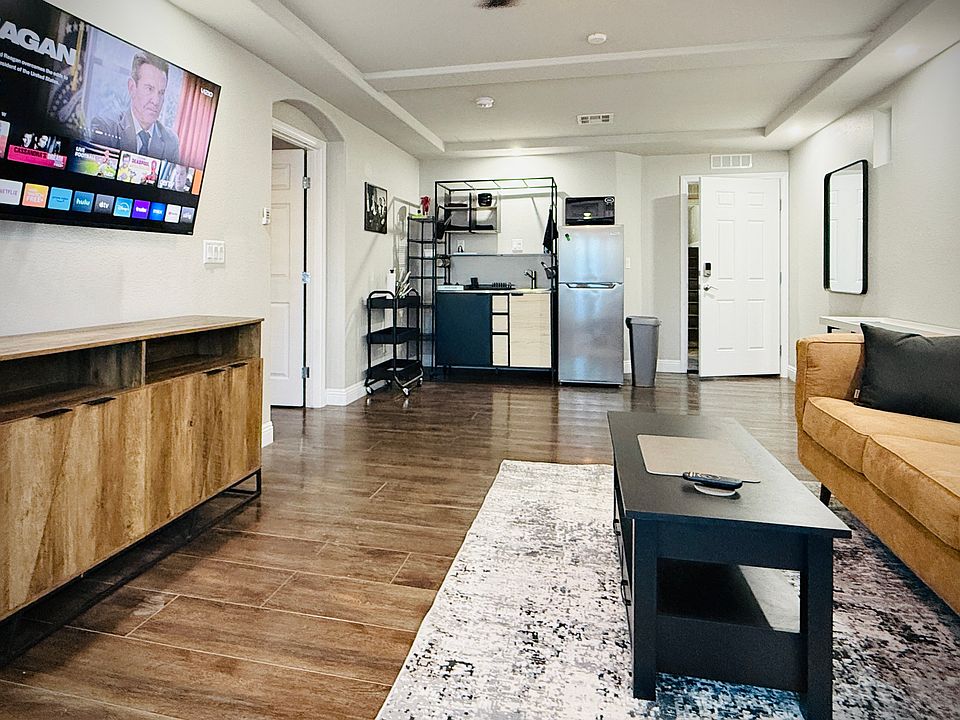 Living Room overlooks the office, TV, and kitchenette.