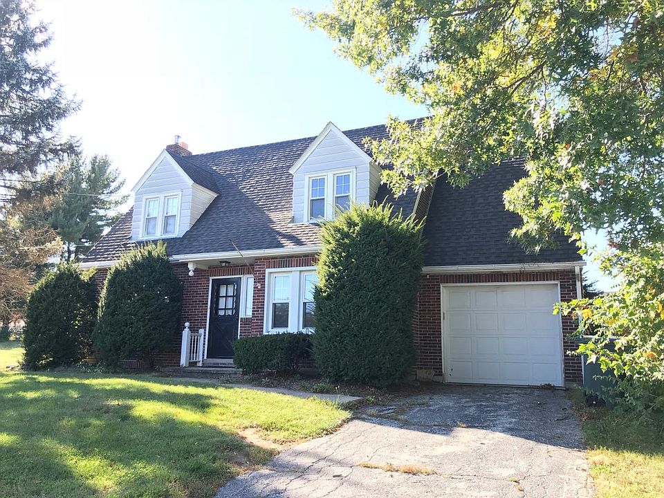 Front of the house. Attached garage.