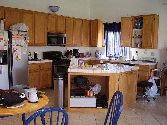 lOTS OF CABINET SPACE, CENTER ISLAND, FAIRLY NEW TILE FLOORS!
