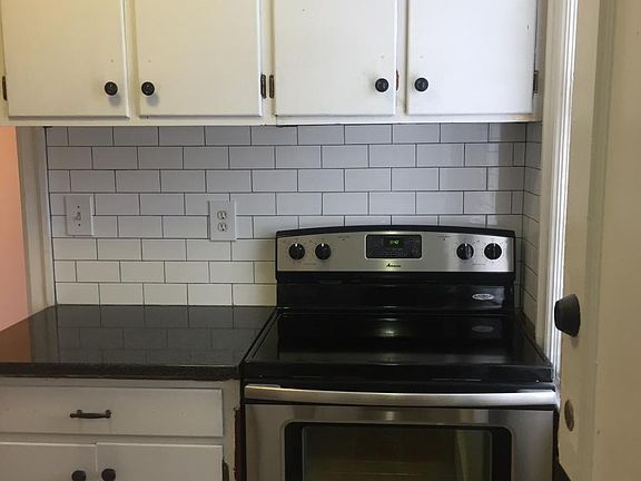 Brand new stainless steal appliances and subway backsplash