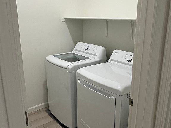 Dedicated laundry room next to bedrooms