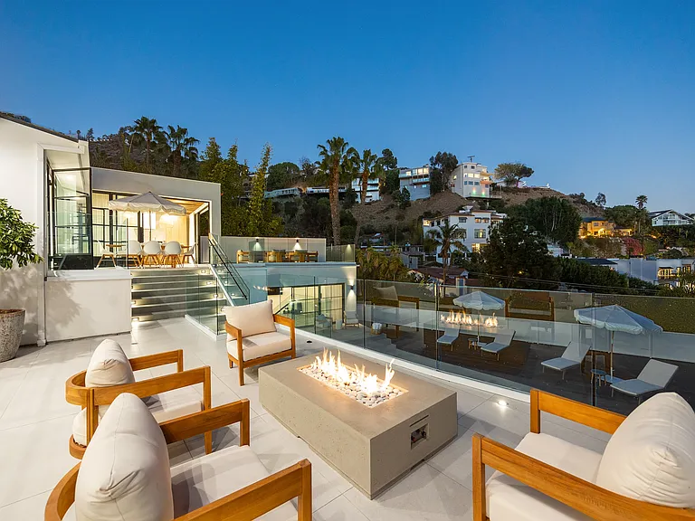 Twinkling city lights and plush seating set the tone for unforgettable nights