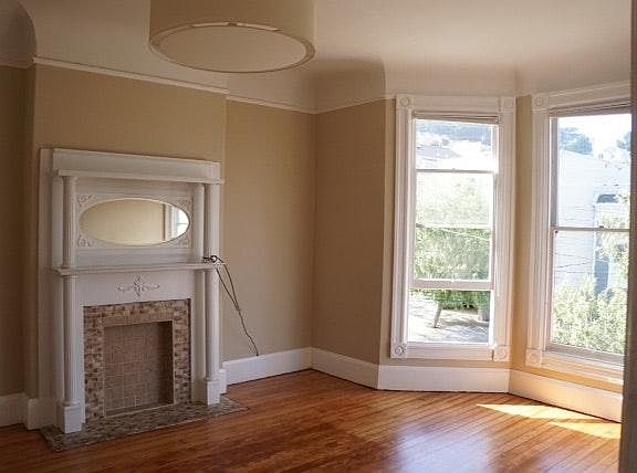 Recently restored hardwood floor in living room