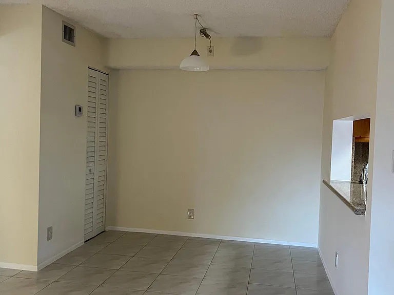 Dining area and A/C unit to the left.