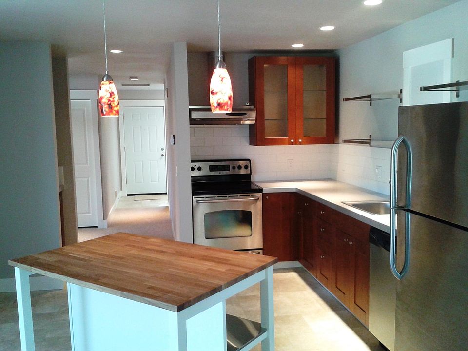 Kitchen with Stainless Appliances and Butcher Block Island