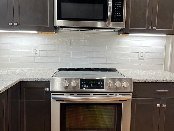 Kitchen, new SS range with microwave oven