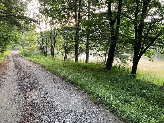 Gravel road leading to house