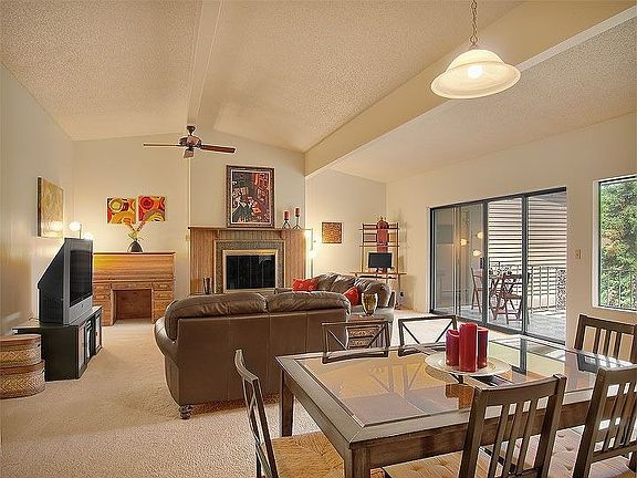 Top Floor Unit with Vaulted Ceilings, Fireplace & Deck