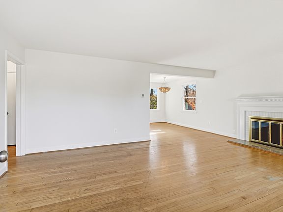 Enter into a big bright open living room with hardwood floors. FIREPLACE IS DECORATIVE ONLY!
