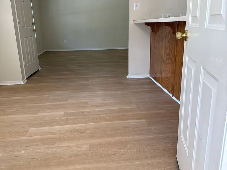 Garage door entry view of dining and living room.