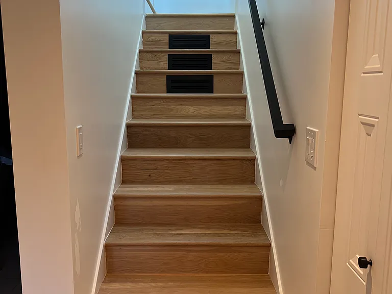 Entryway stairs down to bedrooms