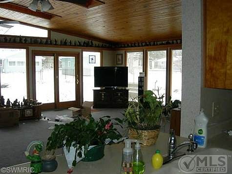 OPEN VIEW FROM KITCHEN INTO FAMILY ROOM