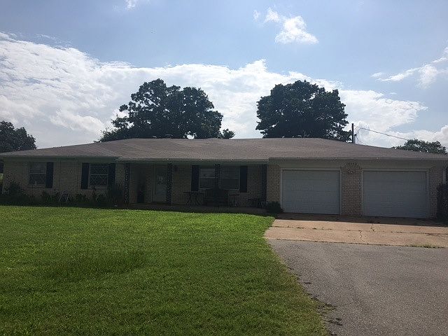 Front photo shows paved driveway