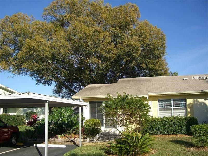 NICELY LANDSCAPED WITH CARPORT AT YOUR FRONT DOOR