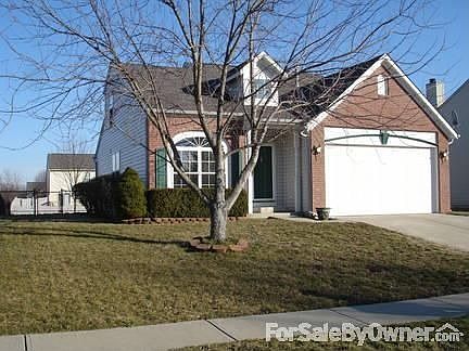 Front of house with shade tree