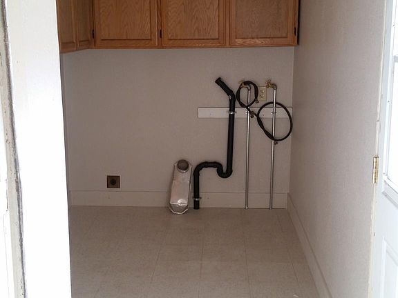 Fresh paint and flooring in the laundry room.