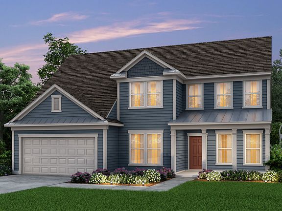 Vanderbilt New Home Exterior 55 with front porch and metal roof accents.