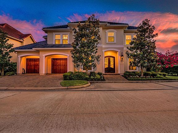 This home is beautiful inside and out. Special attention was paid to details such as the brick walkway that leads to the covered porch with gas lantern and gorgeous doors along with the wide brick driveway that leads to the two car garage with custom