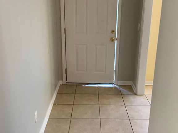 Front entrance with Tile with Dinette and kitchen to the right