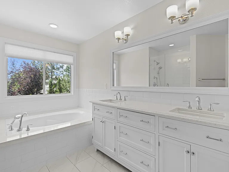 Enjoy the convenience of a double-sink vanity with plenty of cabinet and drawer space.