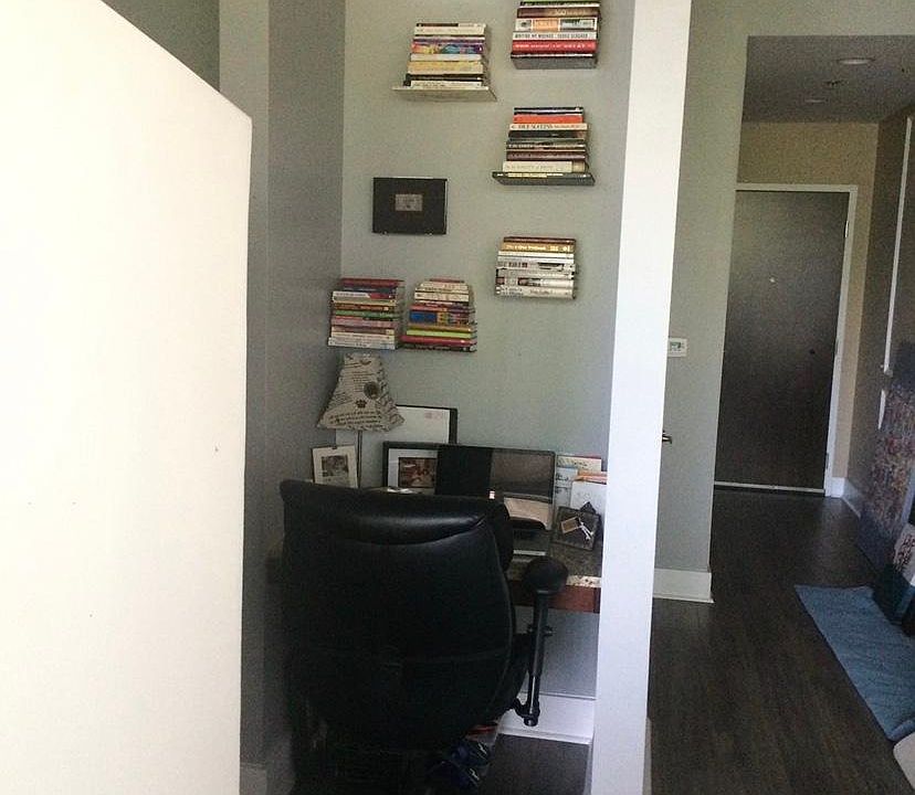 Amazing floating book shelf, comfy office nook and foyer...