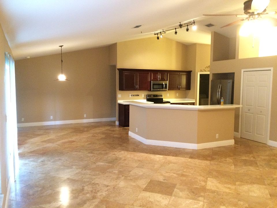 Travertine tile throughout