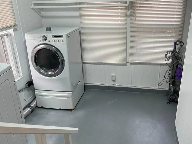 Laundry room with washer & dryer provided, mudroom exit to backyard and door to basement