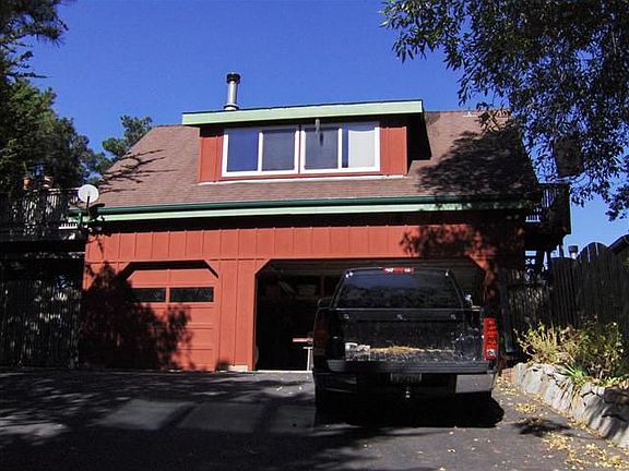 Detached 3 car garage with guest unit overhead