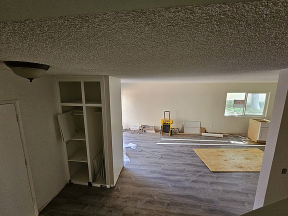 Downstairs. Open concept. Entry, dining & living rooms, kitchen, half bath. *Currently being remodeled*