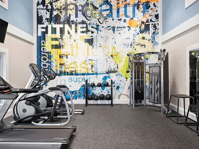 Mirrors help keep your form in check in our expansive fitness center.