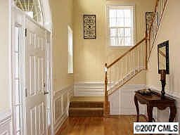 dramatic two-story foyer with turned staircase 