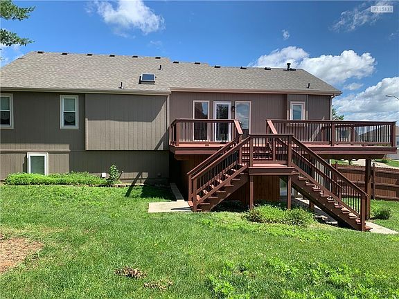 Back of house with deck and patio