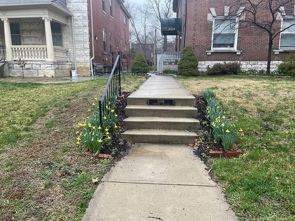 Front walk leading up to the main entry on the west side of the building.