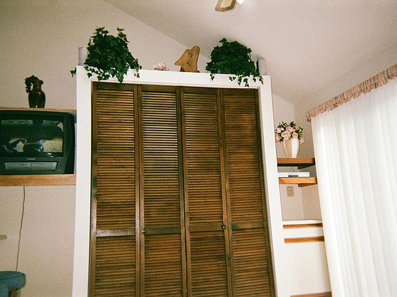 Behind louver doors is the Queen Size Murphy's Bed