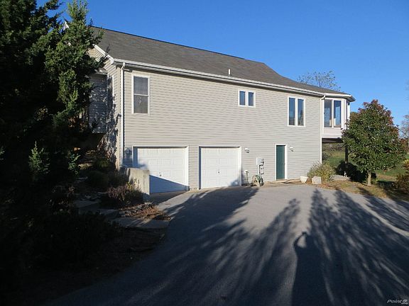 2 Car Garage and Paved Driveway for Ample Parking